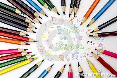 Pencils with children`s scribbles and the inscription back to school Stock Photo
