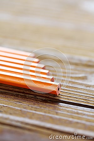 Pencils lying on wood table Stock Photo