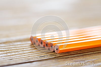 Pencils lying on wood table Stock Photo