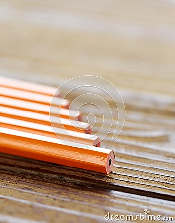 Pencils lying on wood table Stock Photo