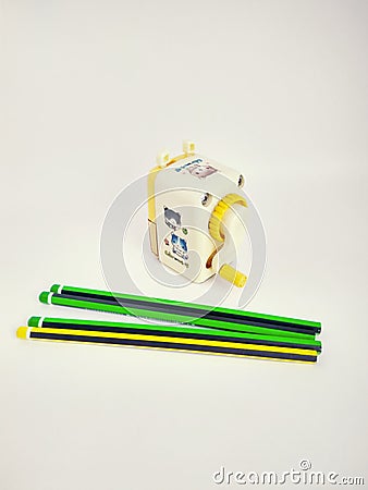 Few pencils and mechanical sharpener on white Editorial Stock Photo