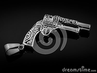 Pendant on neck - Revolver - Stainless steel Stock Photo