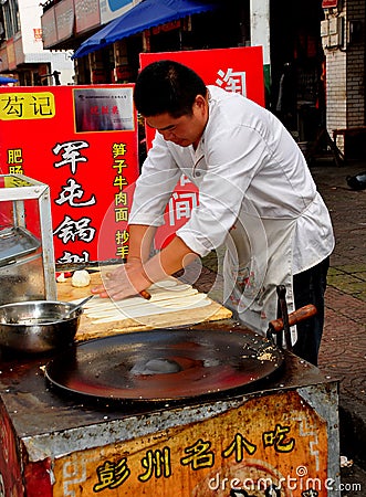 Pengzhou, China: Chef Making Chinese Pizza Editorial Stock Photo