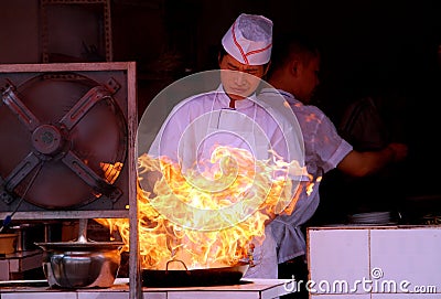 Pengzhou, China: Chef Stir-Frying Food Editorial Stock Photo