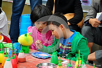 Pengzhou,China: Children Painting Figurine Editorial Stock Photo