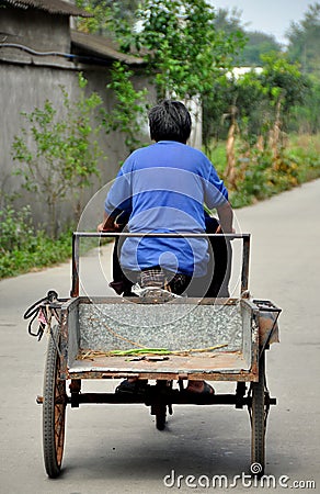 Pengzhou, China: Elderly Woman Driving Bicycle Cart Editorial Stock Photo