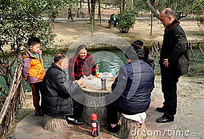 Pengzhou, China: Family Playing Cards Editorial Stock Photo
