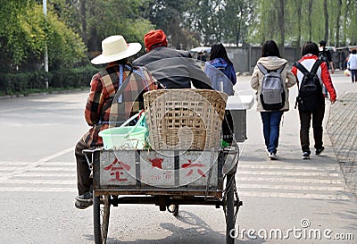 Pengzhou, China: Farmers in Bicycle Cart Editorial Stock Photo