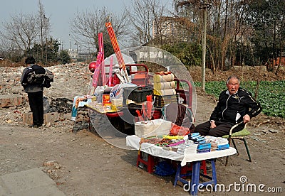 Pengzhou, China: Man Selling Fireworks and Sundries Editorial Stock Photo