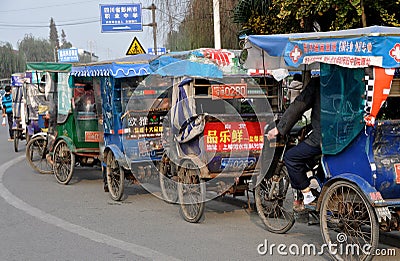 Pengzhou, China: Queue of Bicycle Taxis Editorial Stock Photo