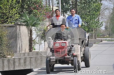 Pengzhou, China: Three Workers Riding in Truck Editorial Stock Photo