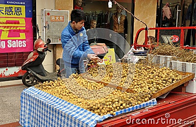 Pengzhou, China: Vendor Selling Longan Fruits Editorial Stock Photo