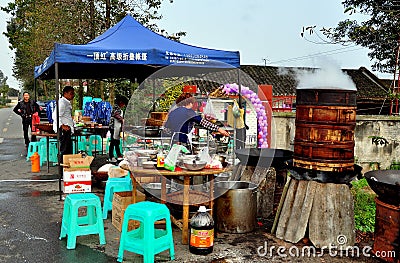 Pengzhou, China: Woman Cooking at Wedding Luncheon Editorial Stock Photo