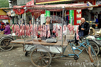 Pengzhou, China: Woman Selling Pork Editorial Stock Photo