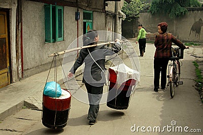 Pengzhou, China: Women on Hua Lu Editorial Stock Photo