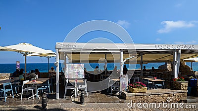 Touristic restaurants overlooking the beautiful turquoise coean at the historical centre of Peniscola, Castellon, Spain Editorial Stock Photo