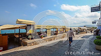 Touristic restaurants overlooking the beautiful turquoise coean at the historical centre of Peniscola, Castellon, Spain Editorial Stock Photo