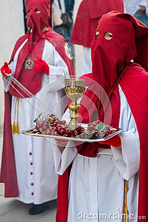 Penitents in the beginning of the Easter procession. Editorial Stock Photo