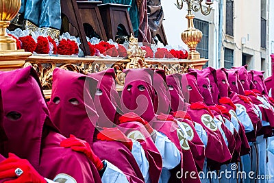 Penitents in the beginning of the Easter procession. Editorial Stock Photo