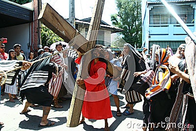 Penitents reenacting the Passion of Christ. Editorial Stock Photo