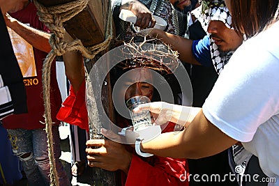 Penitents reenacting the Passion of Christ. Editorial Stock Photo