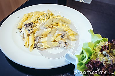 Penne creamy mushroom sauce Stock Photo