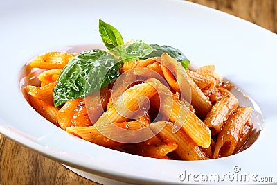 Penne pasta in tomato sauce Stock Photo