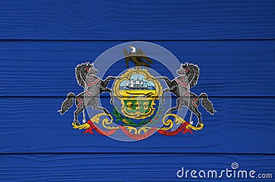 Pennsylvania flag color painted on Fiber cement sheet wall background. Coat of arms of Pennsylvania on blue field Stock Photo