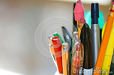 Pens and Pencils on Desk Stock Photo