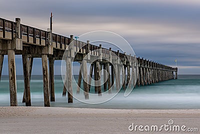 The Pensacola Beach pier in the morning looking out on the Gulf of Mexico Stock Photo