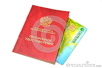 A pension certificate and a plastic card of Sberbank of Russia on a white background. Russian text - pension certificate, Sberbank Editorial Stock Photo