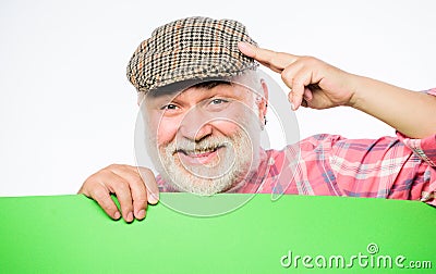 Pensioner grandfather in vintage hat hold poster information copy space. Event announcement. Announcement concept Stock Photo