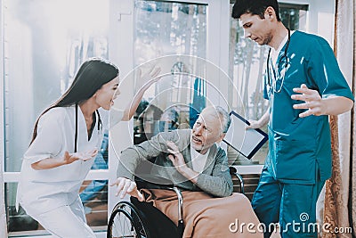 Pensioner Sitting in Wheelchair. Emotional Talk. Stock Photo