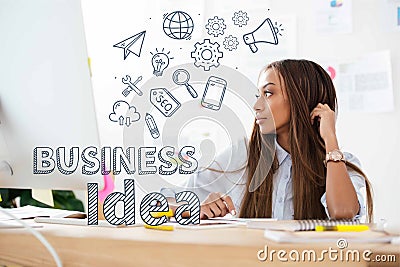 pensive african american businesswoman looking away at workplace in office, business idea inscription and various Stock Photo