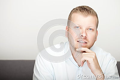 Pensive attractive young man Stock Photo