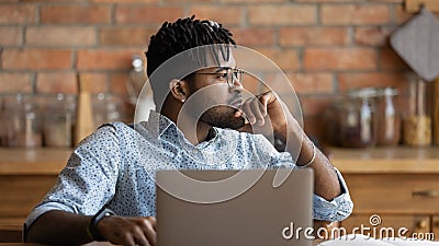 Pensive biracial man look in distance thinking planning Stock Photo