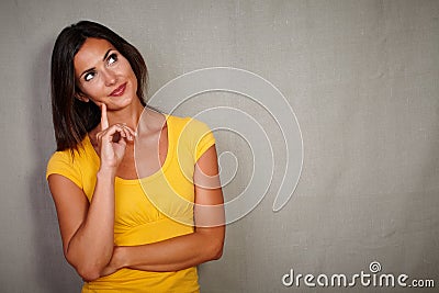 Pensive brunette lady thinking while looking away Stock Photo