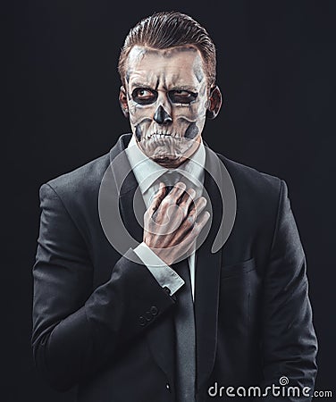 Pensive businessman with makeup skeleton Stock Photo