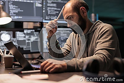 Pensive coder brainstorming ideas to find source code Stock Photo