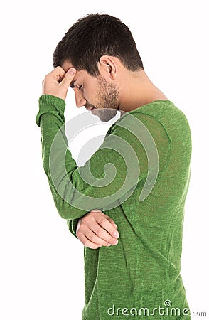 Pensive or depressive isolated man in green pullover. Stock Photo