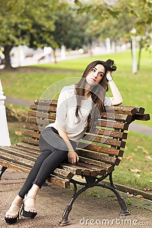 https://thumbs.dreamstime.com/x/pensive-elegant-beautiful-woman-sitting-old-bench-park-46063708.jpg