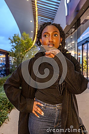 Pensive Gaze Amidst City Lights Stock Photo