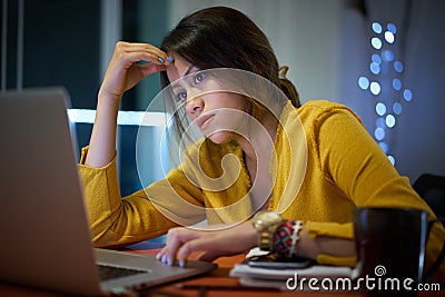 Pensive Girl College Student Studying At Night Stock Photo