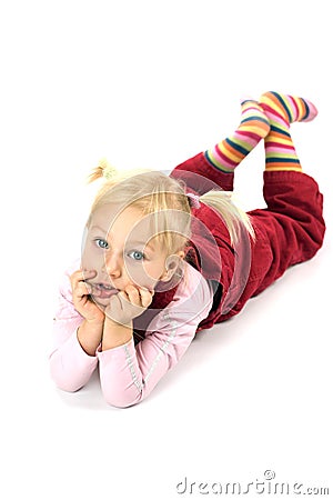 Pensive girl lying on the floor Stock Photo