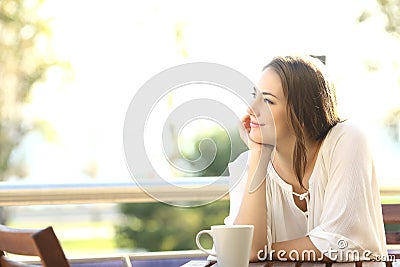 Pensive happy woman remembering Stock Photo