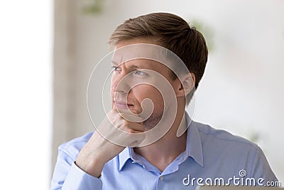 Pensive man making complicated business decision, solving problems. Stock Photo