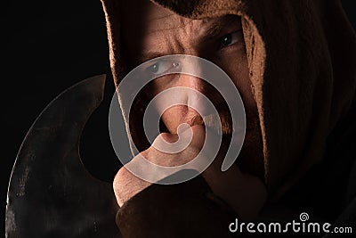 Pensive medieval Scottish warrior with battle Stock Photo