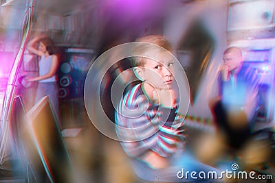 Pensive preteen boy solving riddles in quest room Stock Photo