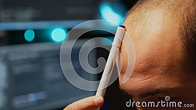 Pensive programmer brainstorming ideas to create user interface Stock Photo