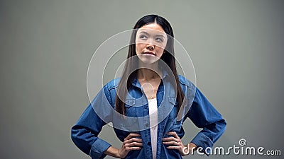 Pensive woman thinking, suspiciously looking aside, day planning, hesitation Stock Photo